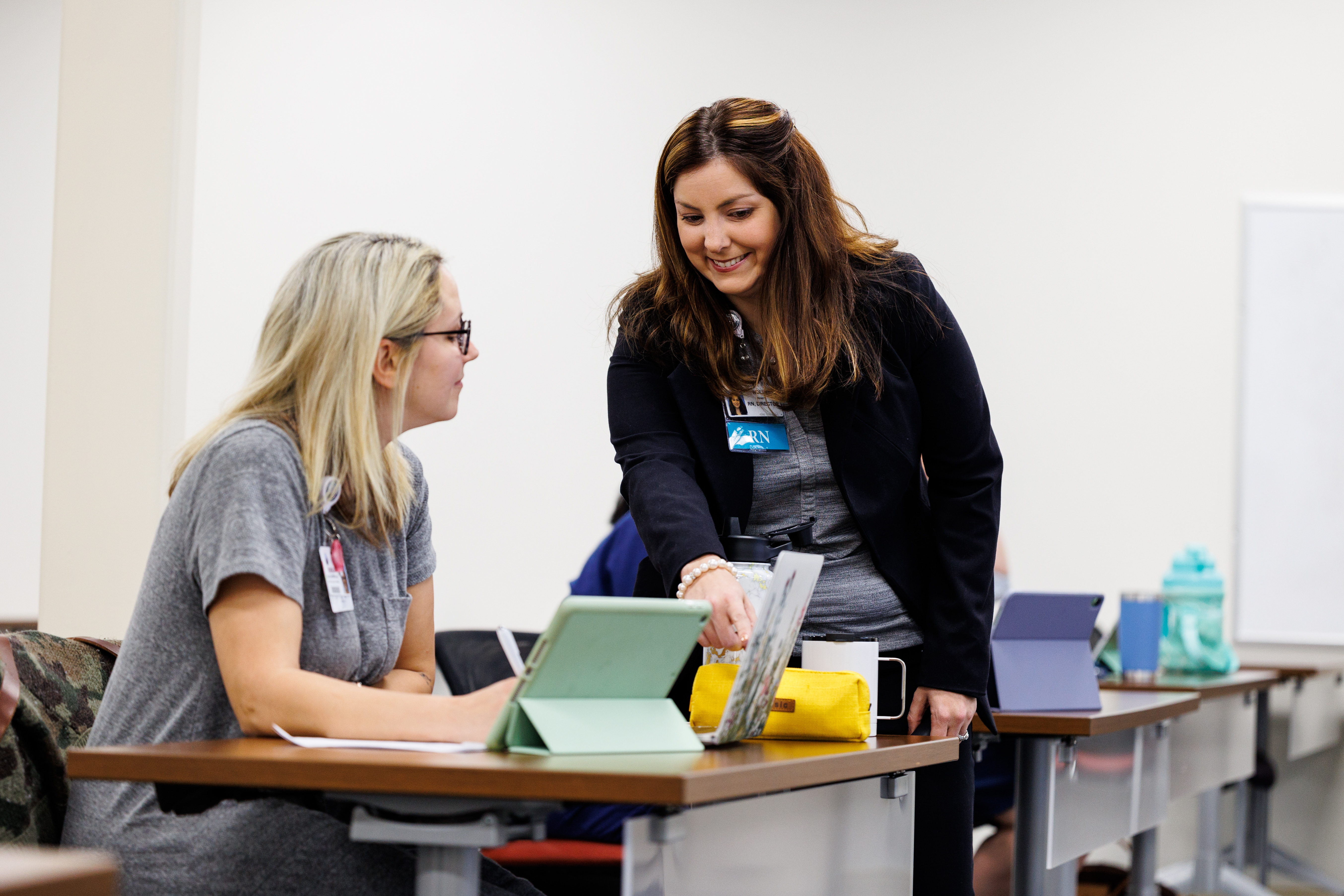 Instructor with student in Centra College building